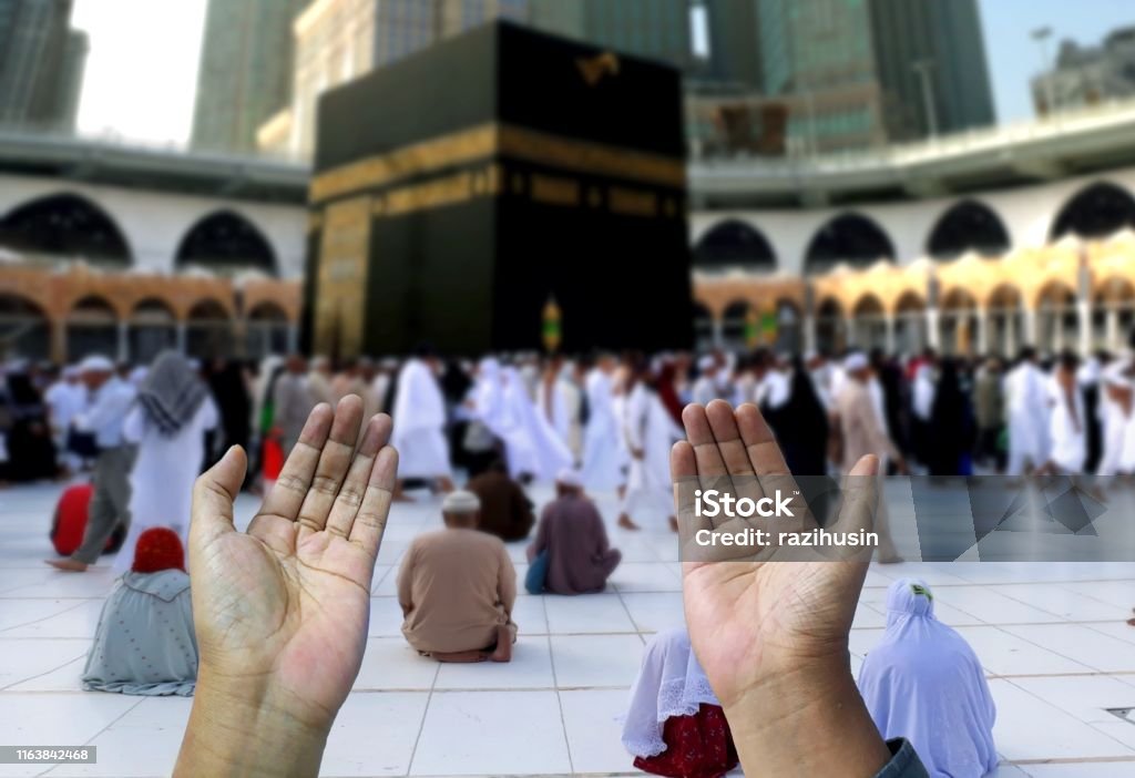Muslim of islam praying hands Hajj Stock Photo