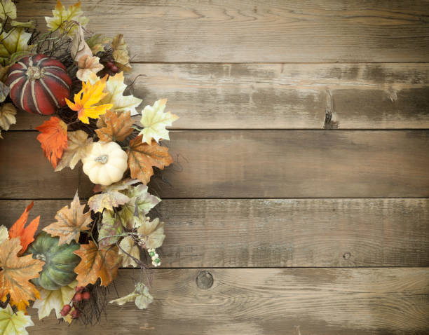istock Autumn Pumpkin Wreath on an Old Wood Background 1163843051