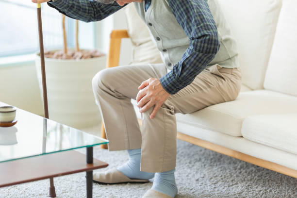 Senior man hurting his knee stock photo