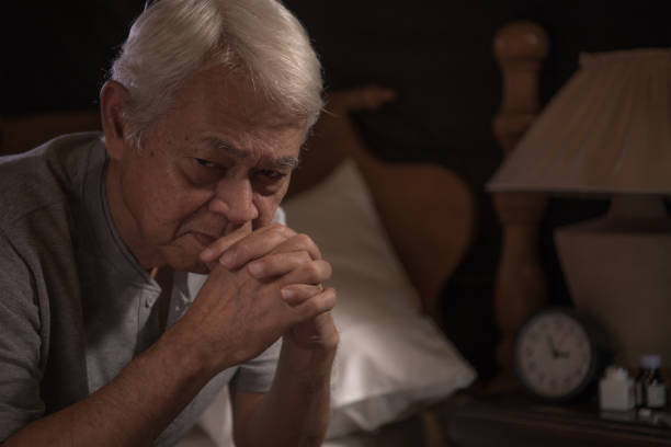 istock A depressed senior person sitting in bed cannot sleep from insomnia 1163849637