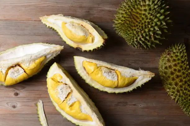 Durian riped and fresh ,durian peel with yellow colour on wooden table