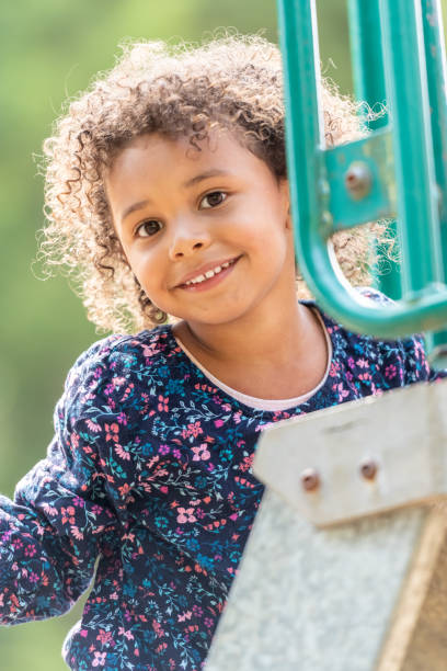 istock Smiling black little girl looking at the camera 1163850366