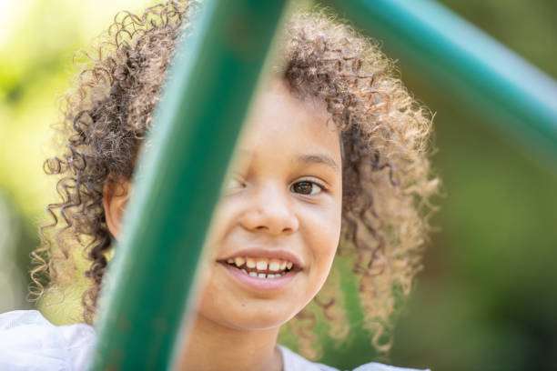istock Smiling little girl looking at the camera 1163850396