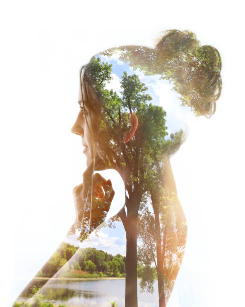 istock Multiple exposure of a young woman, lake and forest 1163851716