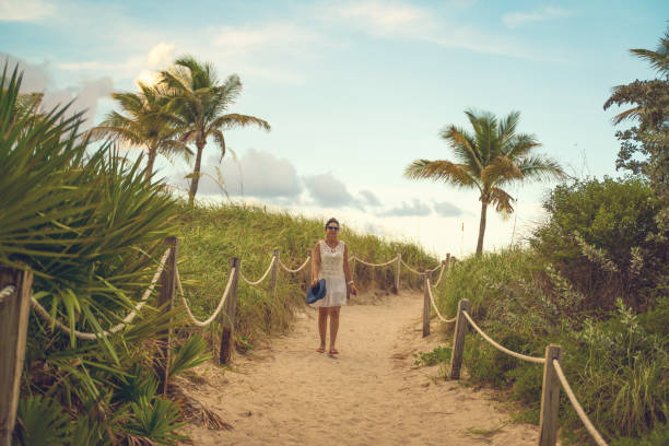 istock Woman on a footpath in Miami Beach 1163852494
