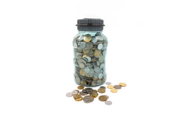 istock Transparent see thru coins saving box piggy bank isolated on white background 1163852658