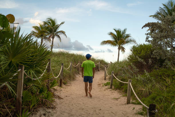 istock Teen on a footpath in Miami Beach 1163852731