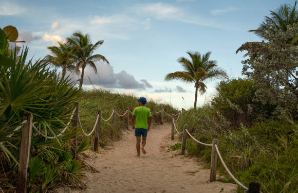 istock Teen on a footpath in Miami Beach 1163852797