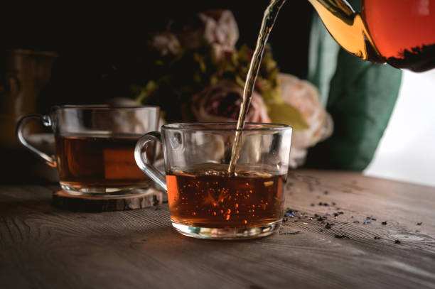 istock Pouring tea into cup of tea 1163855173