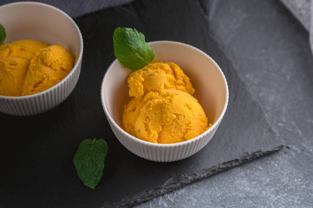 Mango ice cream sorbet with mint leaves