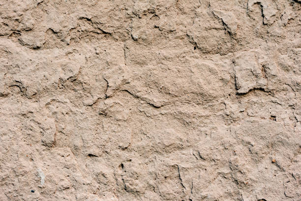 istock Texture of a concrete wall with cracks and scratches which can be used as a background 1163856525