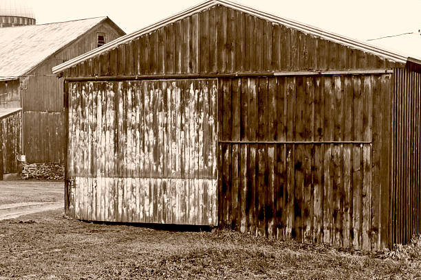 istock Weathered Barn in Winter Rain Monochromatic light sepia tone 116385661