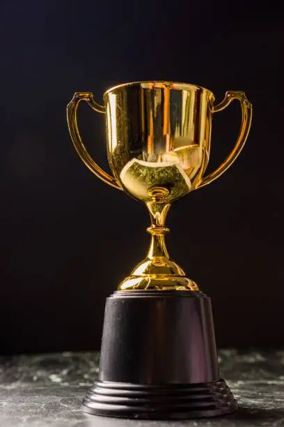 Trophy isolated against black background
