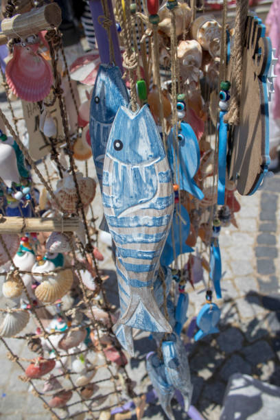 istock Souvenirs. Coloring fish and sea shells 1163859447