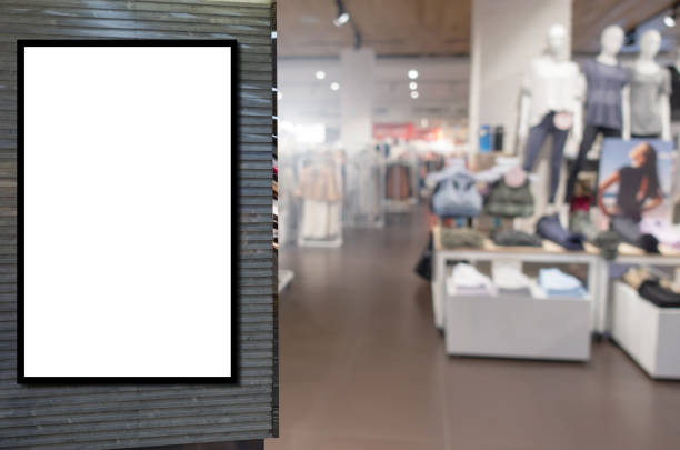 istock blank showcase billboard or advertising light box for your text message or media content with blurred image popular women fashion clothes shop showcase in shopping mall, commercial, marketing concept 1163861029
