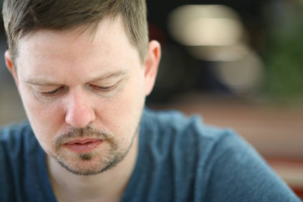 istock Sad and Overwhelmed Bearded Man Close-up Portrait 1163861053