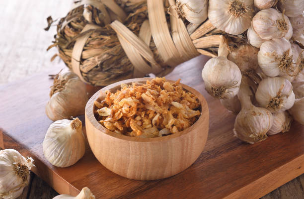 fried garlic on wooden bowl