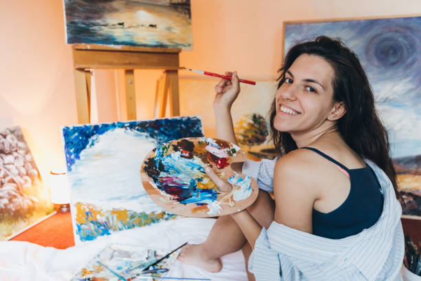 istock Woman painter working on her art 1163865209