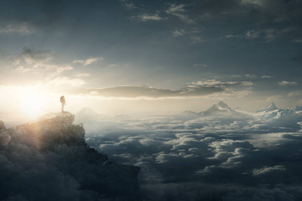 istock Hiker at sunrise on a mountain peak 1163867550