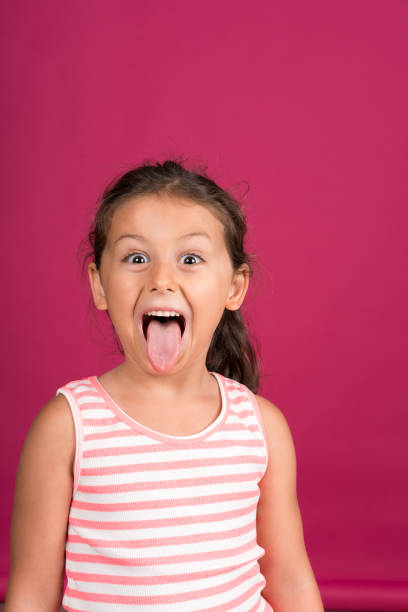 istock Little girl making a face 1163871670