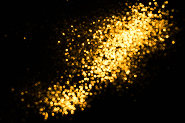 istock Golden abstract bokeh on black background. 1163872382