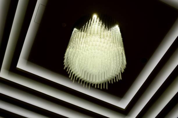 istock Cascading ceiling chandelier in a hotel lobby, view from below, creating almost abstract effect. 1163872761