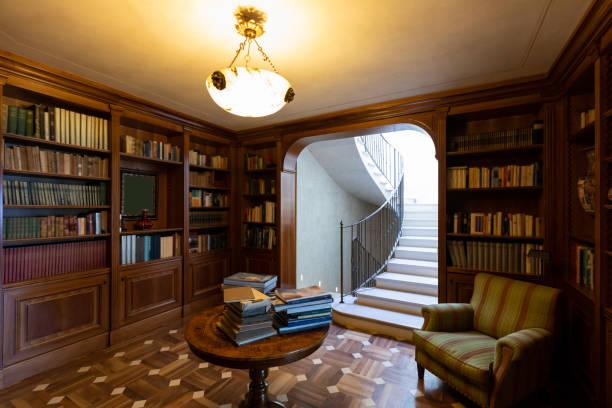 Spacious villa with open office in colonial style with big wood desk and stylish chair