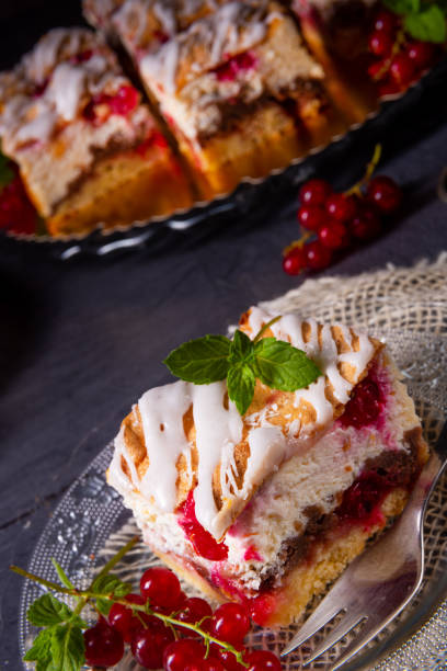 istock Cheese cake with meringue and red currants 1163875272