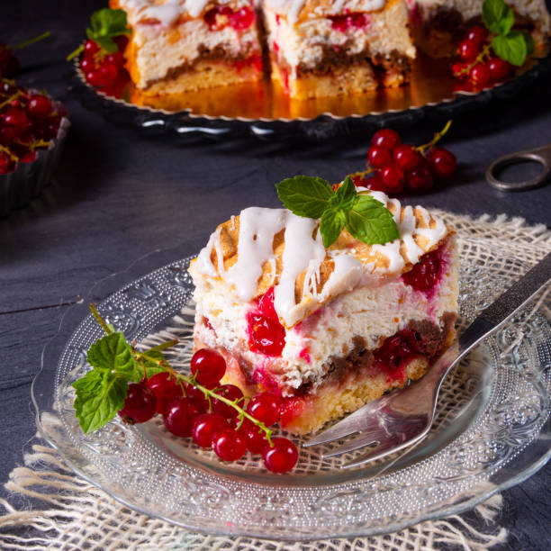 istock Cheese cake with meringue and red currants 1163875288