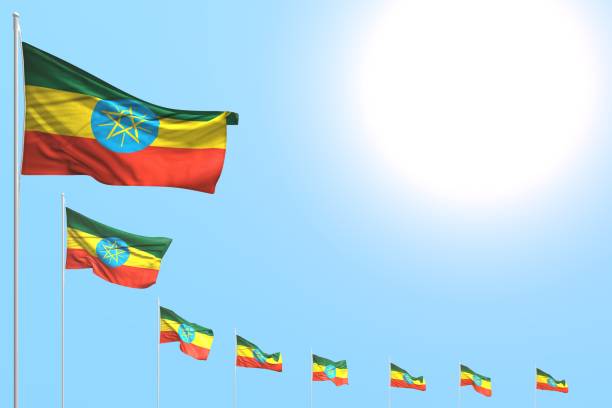 istock cute feast flag 3d illustration
 - many Ethiopia flags placed diagonal on blue sky with place for content 1163875913