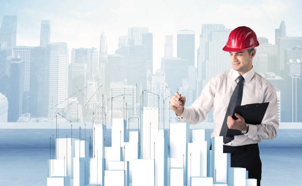istock Businessman drawing skyscrapers 1163876386