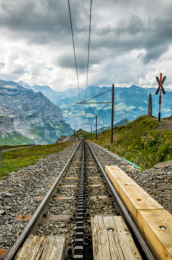 Electric Swiss train track in the alps of Switzerland.