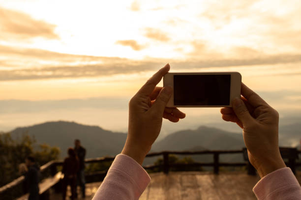 istock The women hands using mobile phone photo Mountain nature 1163877763