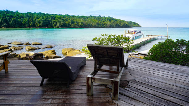 istock Chairs And Table By Sea Against Sky 1163883054
