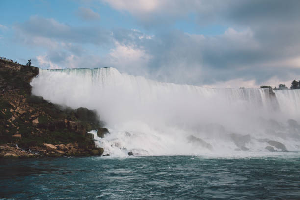 istock Scenic View Of Waterfall Against Sky 1163883238