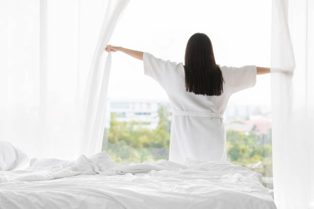 istock woman in bedroom 1163884767