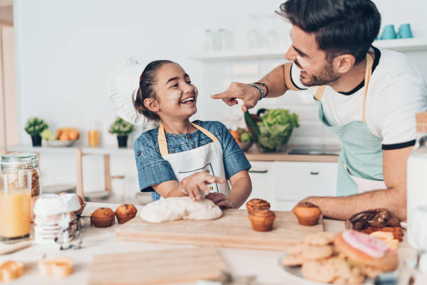 istock Father and daughter getting messy in the kitchen 1163884770