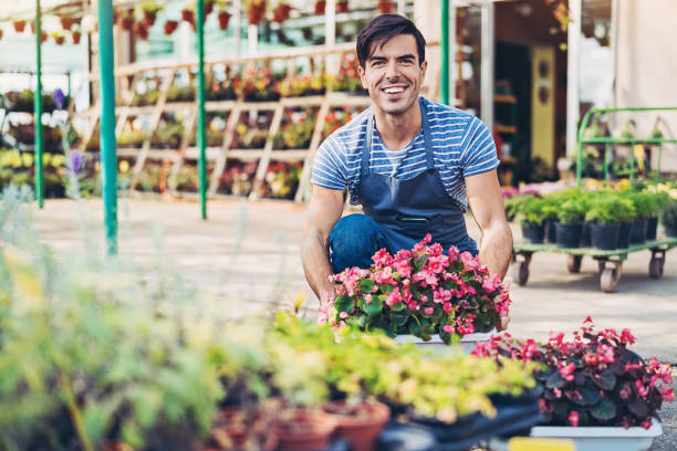 istock Gardener arranging a flower planter 1163884778