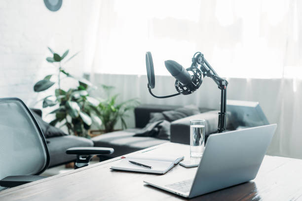 istock broadcasting studio with laptop and microphone on wooden desk 1163884811