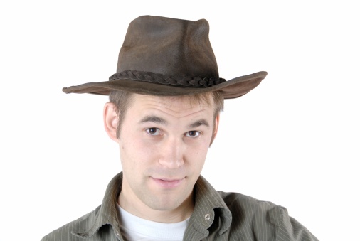 A young man in an all leather cowboy hat.