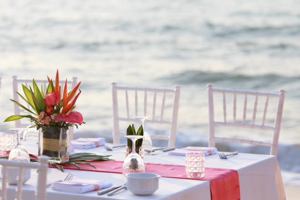 istock Wedding table set up on the beach. Wedding the tropical theme outdoor dinner table on beach Pattaya Thailand. Impressive and beautiful wedding set up outdoor on the beach. 1163885869