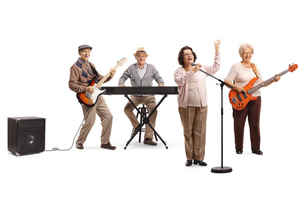 istock Senior people playing in a band an an elderly lady singing on a microphone 1163887328
