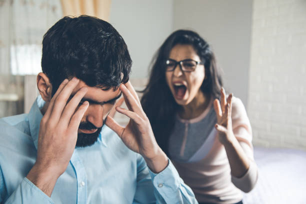 istock angry woman with sad man in home 1163887344
