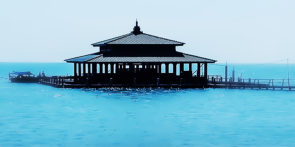 building in the middle of the blue ocean