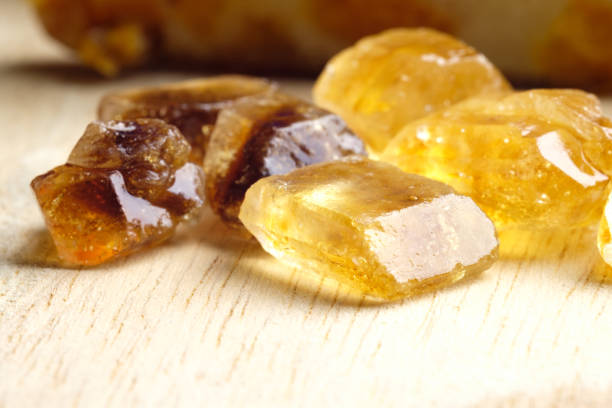 istock shiny pieces of brown cane sugar 1163888378