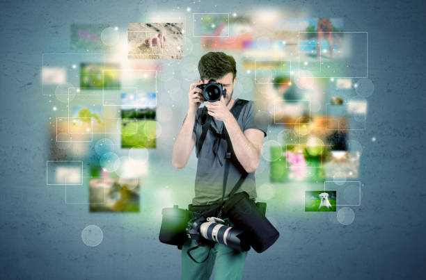 istock Photographer with pictures from the past 1163888465