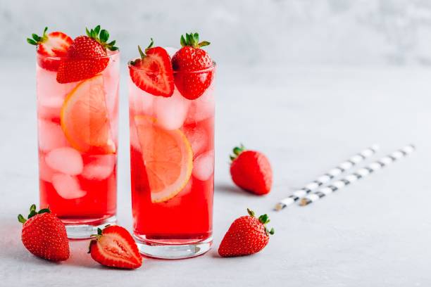 istock Refreshing Strawberry and lemon Iced Tea or lemonade in glasses 1163888939