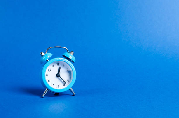 istock A blue alarm clock on a blue background. Limited offer and over time. Planning and discipline. waiting for a meeting. Punctuality. business planning. Life duration and health, increase your age. 1163888965