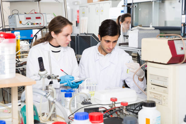 istock Scientists noting results of research in test chart 1163890302