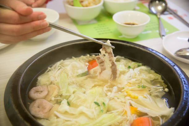 istock eating the meat shabushabu 1163891868